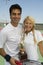 Mixed doubles Tennis Players on tennis court holding trophy portrait