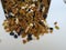 Mixed Dry fruits Scattered or dropping from Metal Container  on white background