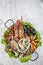 Mixed fresh seafood selection gourmet set platter meal on table