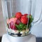 Mixed fresh smoothies of spinach and strawberries in a mixer