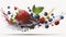 Mixed fruits, strawberries, blueberries, raspberries falling into water on white background