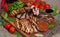 Mixed grilled meat platter. Assorted delicious grilled meat with vegetable.