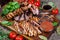 Mixed grilled meat platter. Assorted delicious grilled meat with vegetable.