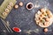 Mixed japanese maki sushi rolls set with chopsticks, ginger, soy sauce,rice on black concrete background, top view