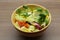 Mixed leaves and tomato salad in a bowl