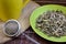Mixed loose tea leaves Green plate Tea infuser Mug