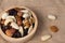 Mixed nut and raisin snack in wooden bowl