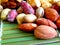 Mixed nuts on a green bamboo tablecloth