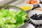 Mixed oak leaf lettuce in stainless bowl