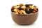 Mixed peanuts and raisins in a brown bowl