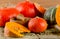 Mixed Pumpkins and seeds on wooden background.