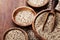 Mixed quinoa in bowl on wooden kitchen table. Healthy and diet superfood product