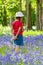 Mixed Race African American Girl Child Walking in Bluebell Wood or Forest