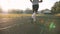 Mixed race athlete runner feet in white socks running on treadmill closeup on shoe