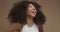 Mixed race black woman portrait with big afro hair, curly hair