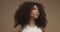 Mixed race black woman portrait with big afro hair, curly hair