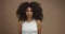 Mixed race black woman portrait with big afro hair, curly hair