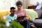 Mixed race boy and his grandmother enjoying their time at home together And using a digital tablet