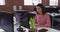 Mixed race businesswoman wearing headset sitting at desk having video call