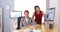 Mixed race businesswomen smiling in office