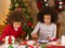 Mixed race children making Christmas cards