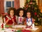 Mixed race children making Christmas cards