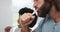 Mixed race couple brushing together in the bathroom