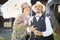 Mixed-Race Couple Dressed in 1920â€™s Era Fashion Sipping Champagne