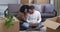 Mixed race couple multiethnic family african american woman and caucasian man sitting on floor of new house surrounded