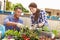 Mixed Race Couple Planting Rooftop Garden Together