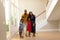 Mixed race couple and their young son and daughter standing in the hallway of their home