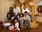 Mixed race family around christmas tree