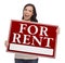 Mixed Race Female Holding For Rent Sign on White
