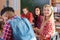 Mixed Race Students Group With Professor Sit Desk University Classroom, Two Beautiful Young Girls Wear Checked Shirt