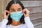 Mixed Race Teenager Girl Woman Wearing Fitting Coronavirus COVID-19 Face Mask