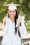 Mixed Race Thumbs Up Girl Celebrating Graduation In Cap