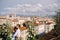 Mixed-race wedding couple. Destination fine-art wedding in Florence, Italy. A wedding ceremony on the roof of the