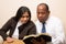 Mixed Raced Christian Couple Studying Bible Together