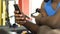 Mixed-raced male using mobile phone in gym, social network and communication