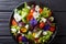 Mixed salad of edible flowers with lettuce, tomatoes and cream c