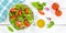 Mixed salad with fresh tomatoes healthy eating food from above banner on a wooden board