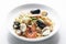 Mixed seafood spaghetti pasta with prawns mussels scallops and c