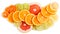 Mixed sliced citrus fruits. Above view.