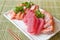 Mixed sliced fish sashimi on ice in white plate. Sashimi Salmon