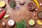 Mixed spices and fresh rosemary on wooden kitchen table top view. Ingredients for cooking. Food background.