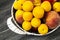 Mixed summer fruit pictures in a basket,White background with a basket of peaches, plums, apples, nectarines, apricot pictures