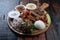 Mixed turkish kebab plate with rice, vegetables and dip sauces on rustic wooden background