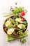 Mixed vegetable salad with potato, olive, tomato
