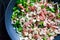 Mixed veggies sautÃ©ing in a pan