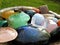 Mixed vibrant and colorful crystal stones in a bowl